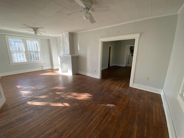 unfurnished living room featuring a fireplace, baseboards, and crown molding