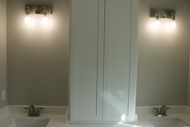 bathroom featuring double vanity and a sink