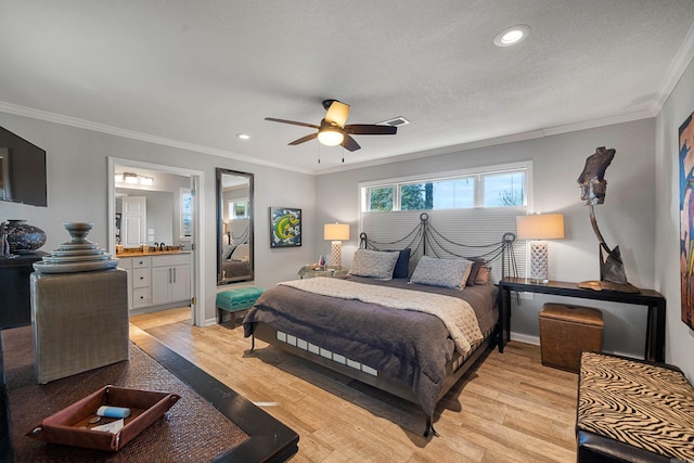 bedroom featuring ornamental molding, light wood-type flooring, a textured ceiling, and recessed lighting