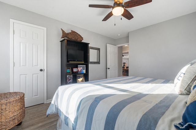 bedroom with ceiling fan and wood finished floors