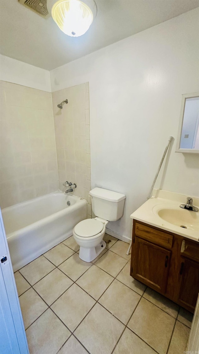 full bath with tile patterned flooring, bathtub / shower combination, vanity, and toilet