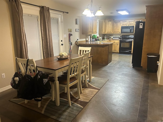 dining area with baseboards and an inviting chandelier