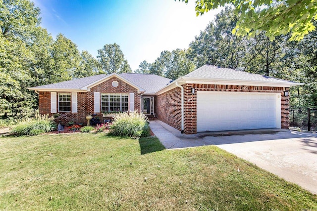 ranch-style house featuring an attached garage, brick siding, concrete driveway, roof with shingles, and a front yard