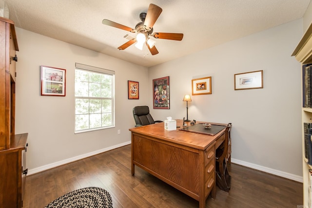 home office featuring dark wood finished floors, a textured ceiling, baseboards, and ceiling fan