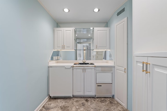 kitchen featuring recessed lighting, visible vents, white cabinets, light countertops, and fridge