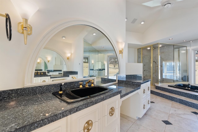 full bath featuring lofted ceiling, tile patterned floors, vanity, a shower stall, and a bath