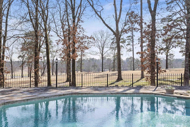 view of swimming pool featuring fence and a fenced in pool