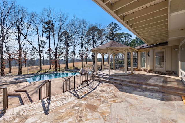 view of swimming pool with a fenced in pool, a patio area, fence, and a gazebo