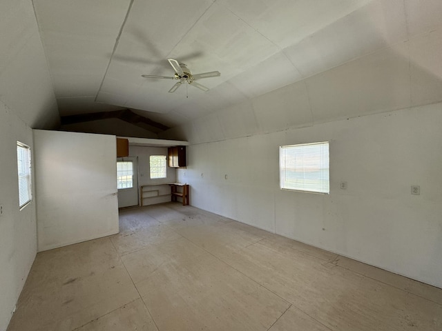 interior space with vaulted ceiling and ceiling fan