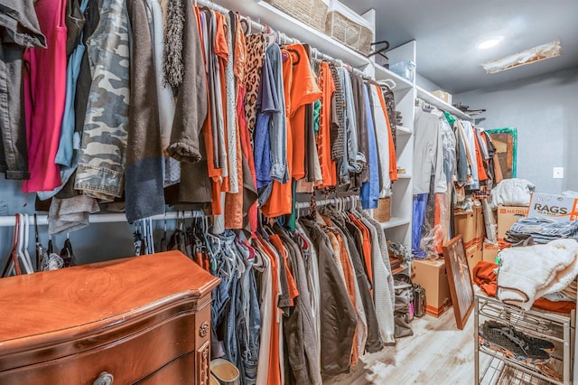 spacious closet with light wood finished floors