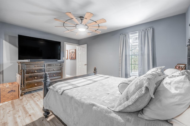 bedroom with light wood-style floors and ceiling fan