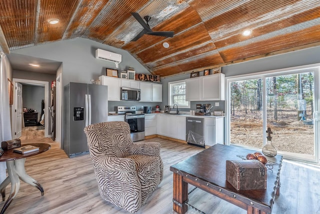 living room with lofted ceiling, light wood-style flooring, an AC wall unit, ceiling fan, and wooden ceiling