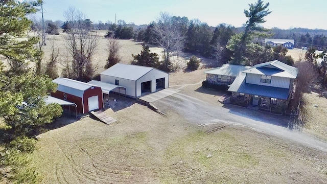 birds eye view of property with a rural view