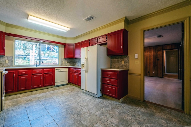 kitchen featuring light countertops, white appliances, visible vents, and decorative backsplash