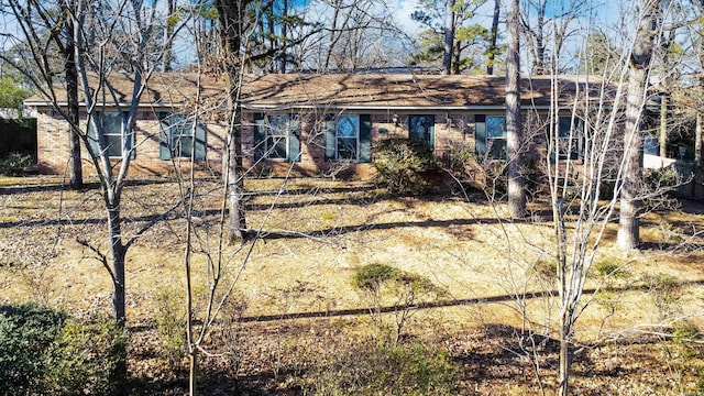 view of front of house featuring brick siding