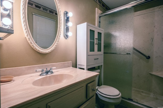 full bathroom with toilet, a shower stall, and vanity