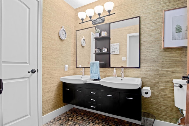 full bath with double vanity, tile walls, and a sink