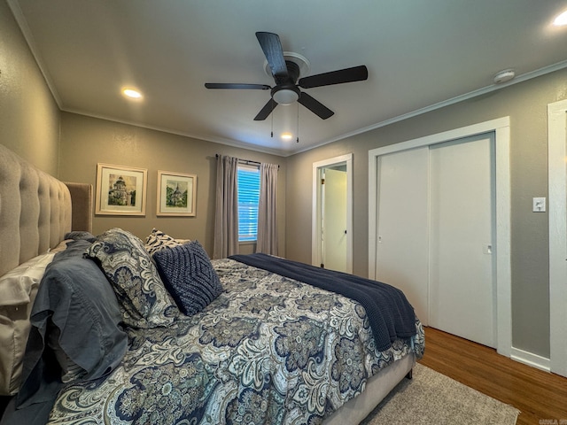 bedroom with ornamental molding, a ceiling fan, and wood finished floors