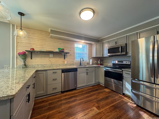 kitchen featuring hanging light fixtures, appliances with stainless steel finishes, open shelves, and gray cabinetry