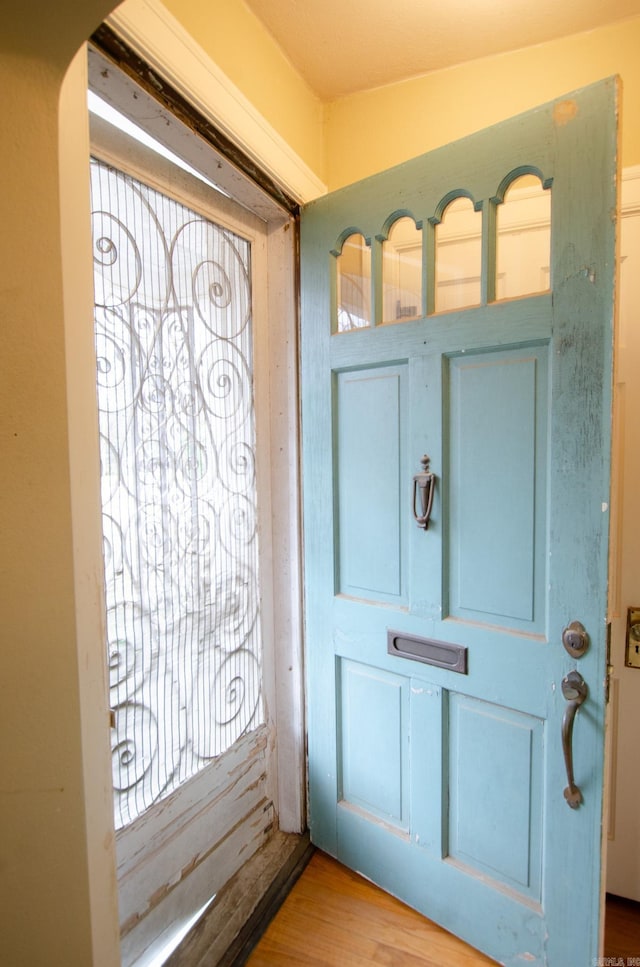 doorway featuring wood finished floors