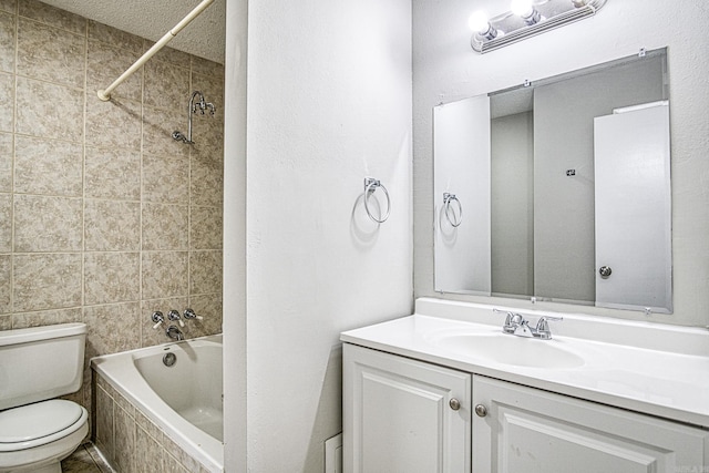 bathroom featuring toilet, bathtub / shower combination, and vanity