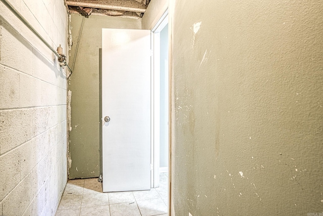 corridor with concrete block wall