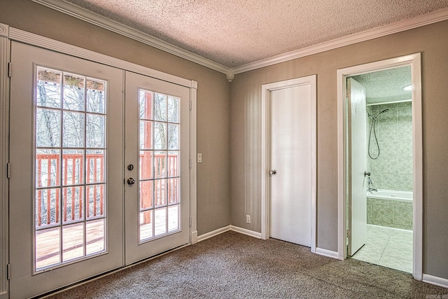 entryway with carpet, a textured ceiling, crown molding, and french doors