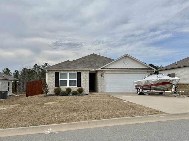 ranch-style house with a garage, brick siding, a shingled roof, concrete driveway, and a front lawn