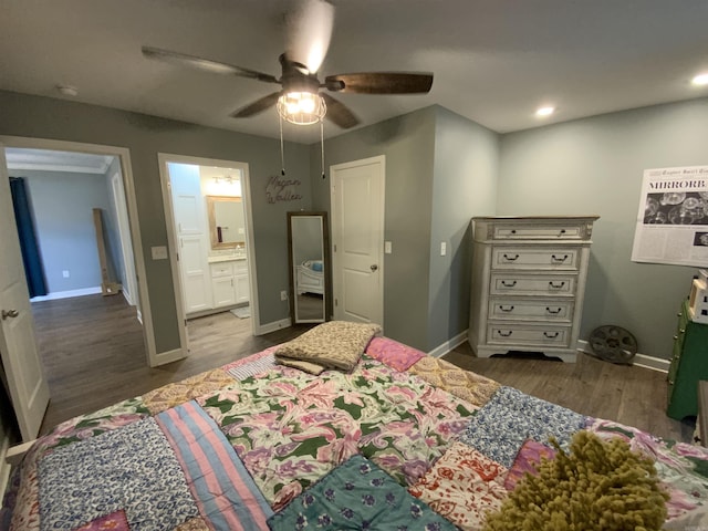 bedroom with baseboards, ceiling fan, dark wood-type flooring, ensuite bathroom, and recessed lighting