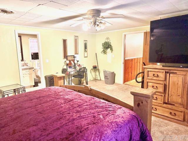 840 S 16th St, Arkadelphia, AR 71923 - bedroom with ornamental molding, a ceiling fan, visible vents, and light colored carpet
