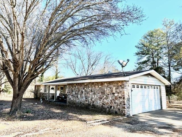 view of side of property with stone siding