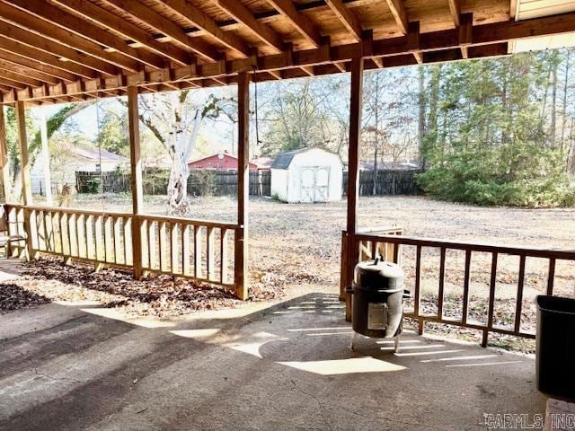 840 S 16th St, Arkadelphia, AR 71923 - deck featuring an outbuilding, a fenced backyard, a patio, and a storage shed