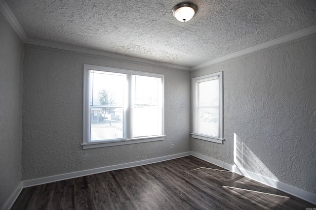 empty room with baseboards, ornamental molding, dark wood-type flooring, and a textured wall