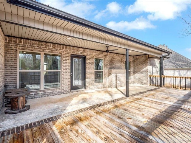 deck featuring ceiling fan and a patio