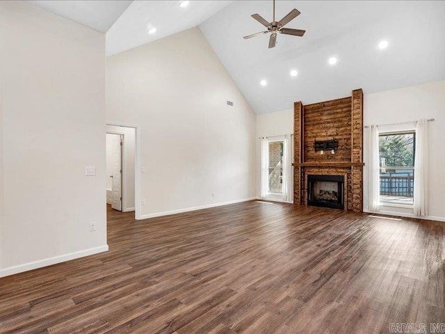 unfurnished living room with dark wood finished floors, a fireplace, baseboards, and ceiling fan