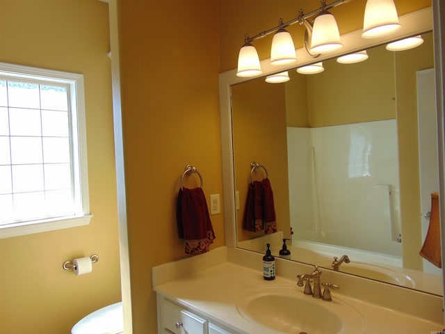 full bathroom featuring toilet and vanity