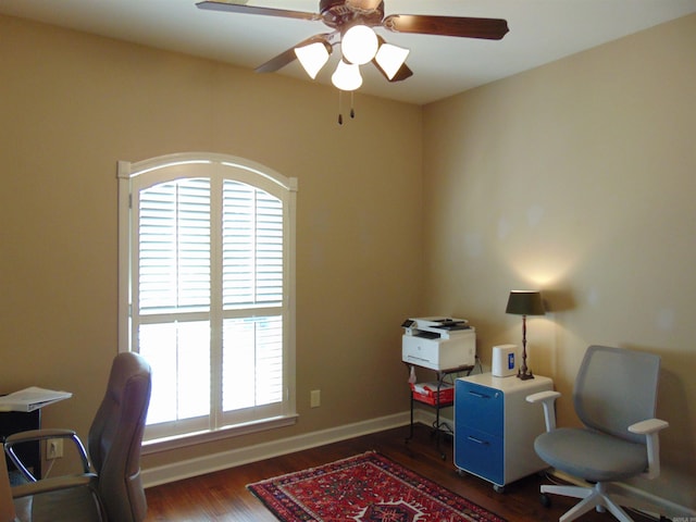 office area featuring wood finished floors, a ceiling fan, and baseboards