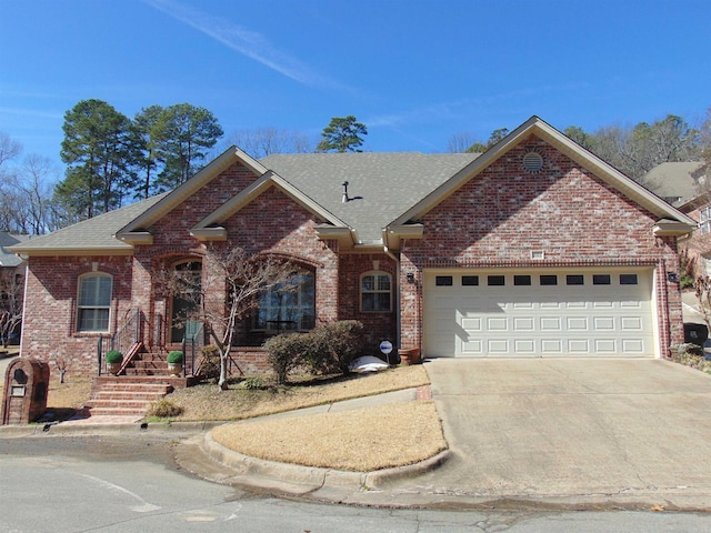 ranch-style home featuring a shingled roof, brick siding, driveway, and an attached garage