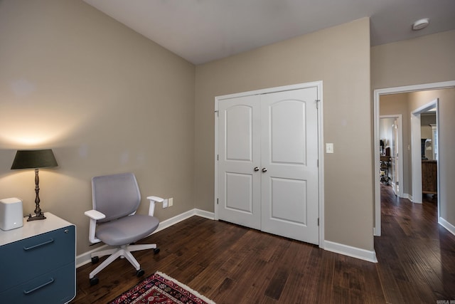 home office with dark wood-style floors and baseboards