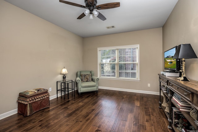 sitting room featuring baseboards, visible vents, ceiling fan, and wood finished floors