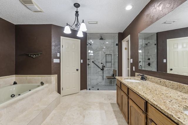 bathroom featuring a tub with jets, a stall shower, vanity, and visible vents