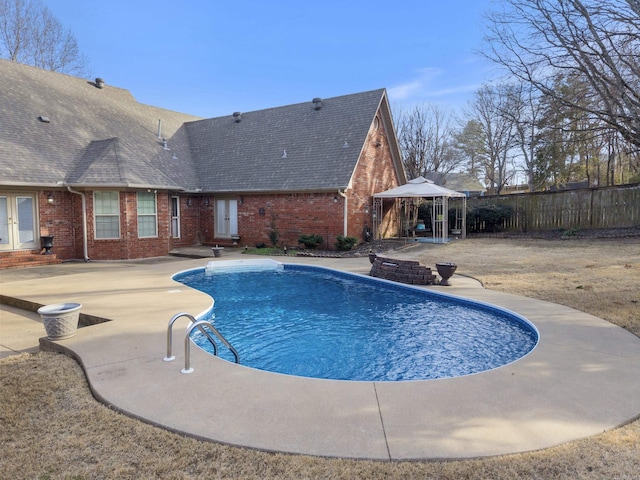 view of pool with a fenced in pool, a gazebo, fence, french doors, and a patio area