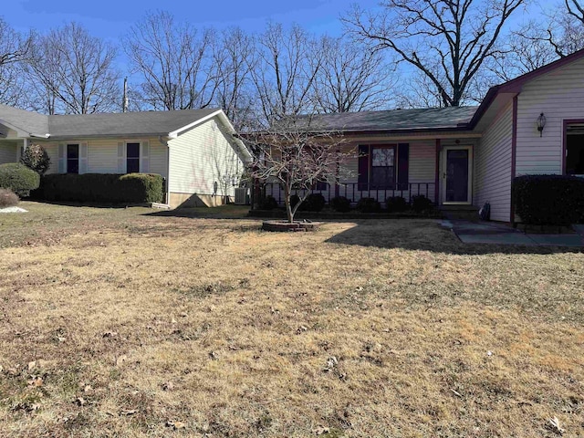 ranch-style home with central AC, a porch, and a front lawn