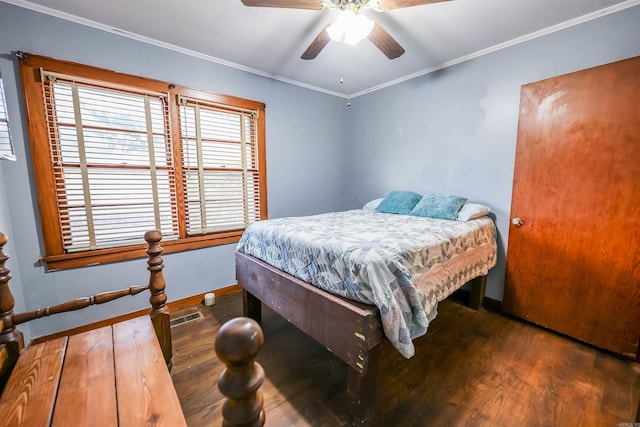 420 Sales St, Camden, AR 71701 - bedroom with visible vents, baseboards, dark wood-style floors, ceiling fan, and ornamental molding