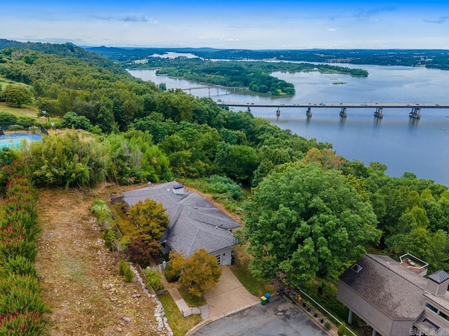 birds eye view of property with a water view