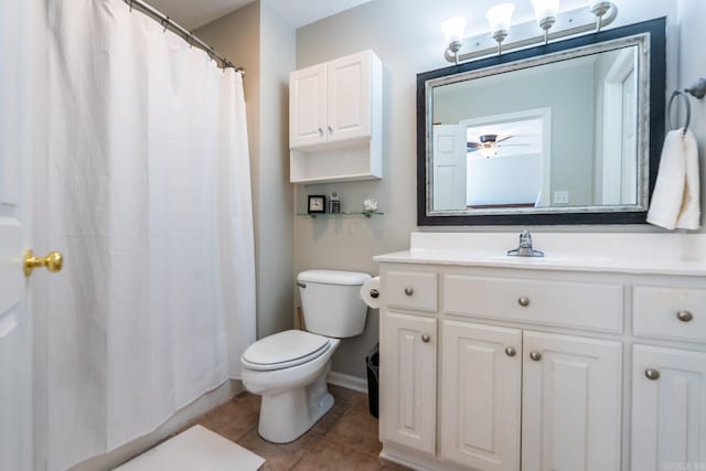 full bathroom with baseboards, vanity, toilet, and tile patterned floors