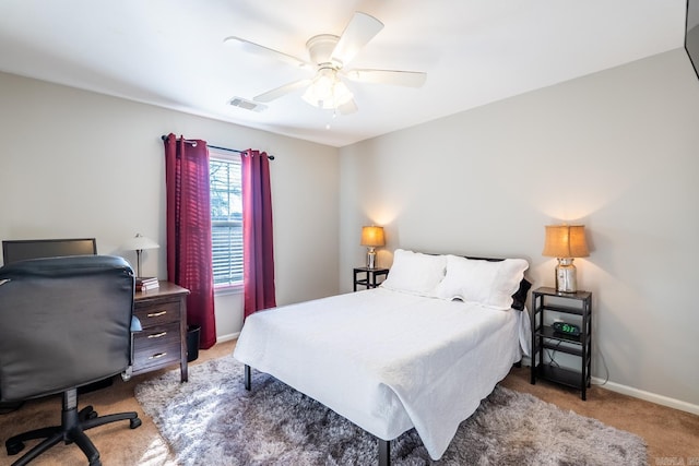 bedroom with a ceiling fan, visible vents, light carpet, and baseboards