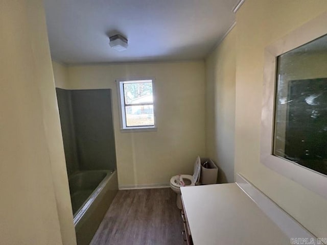 bathroom featuring vanity, shower / tub combination, wood finished floors, and toilet