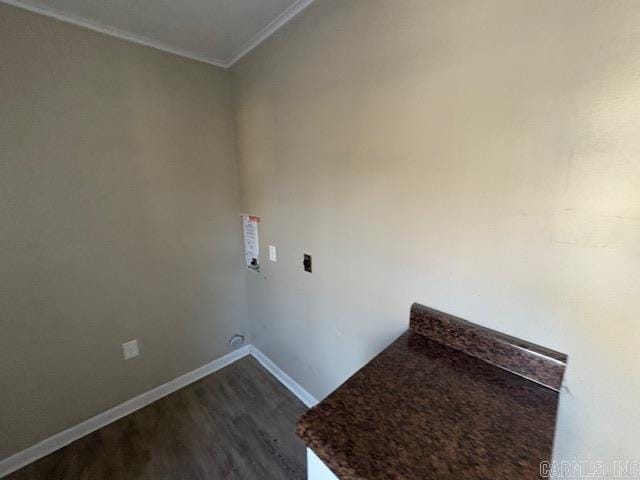 washroom with dark wood-style floors and baseboards