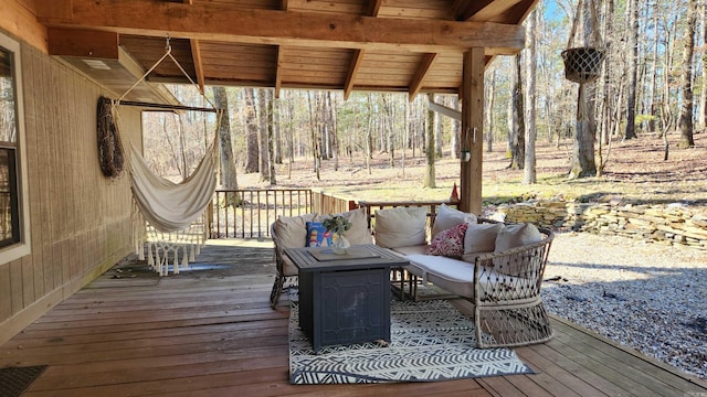 wooden deck with an outdoor hangout area